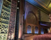 Ornate auditorium at Soho Theatre Walthamstow in London, featuring decorative walls, a balcony and rows of cinema seats.