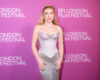 Florence Pugh at the 2026 BFI London Film Festival in a silver gown against a pink backdrop.