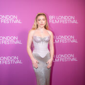 Florence Pugh at the 2026 BFI London Film Festival in a silver gown against a pink backdrop.